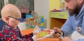 Andrea Presti gives child